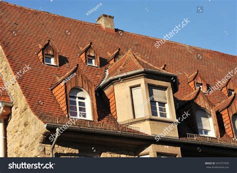 Dormer windows in variety of styles — oz visuals design. Tiled Roof With Many Dormer Windows Stock Photo 541377970 ...