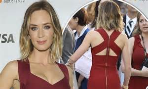 Emily Blunt Shows Off Her Slim Figure In A Form Fitting Maroon Dress At