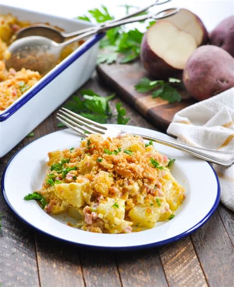 This ham and potato casserole has layers of ham, potatoes and cheese with an au gratin crust on top. Dump-and-Bake Cheesy Ham and Potato Casserole - The Seasoned Mom