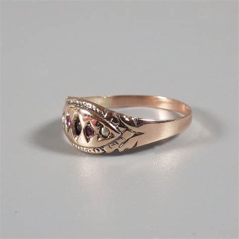 Maybe you would like to learn more about one of these? Victorian 10k Rose Gold Band Ruby Seed Pearl Ring