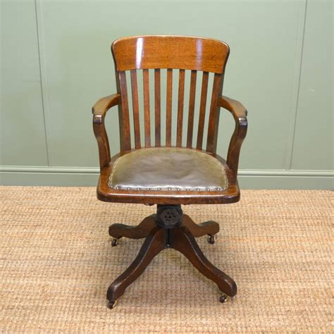 It features a comfortable, leather seat and a solid, wooden backrest. Quality Edwardian Oak Antique Swivel Office Chair - Antiques World