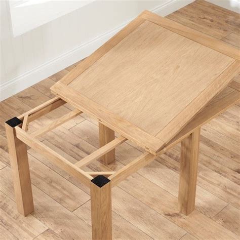 Table features a solid wood top that rests upon a pair of distinctive, available in solid oak or cherry. Schedar Flip Top Extending Dining Table In Oak | Furniture ...