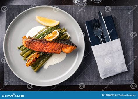 Broiled Salmon Grilled Fried Salmon With Asparagus And Lemon Stock