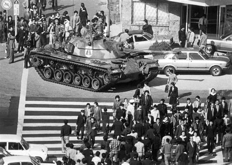 When a country has martial law, there's no independent judiciary to oversee law enforcement activities. People walk beside a M48 Patton tank after martial law was ...
