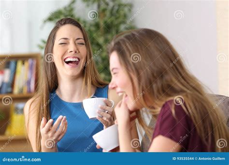 Two Friends Laughing Loud At Home Stock Photo Image Of Enjoying
