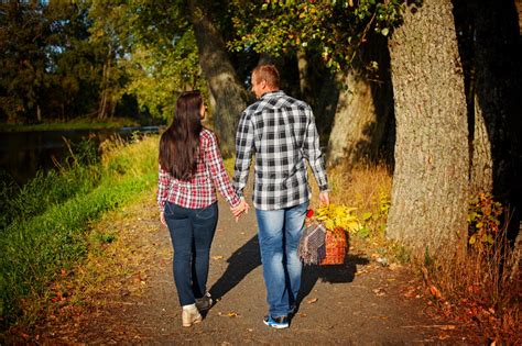 Man And Woman Go For Walk On Autumn Picnic Couple Walking Stock Image