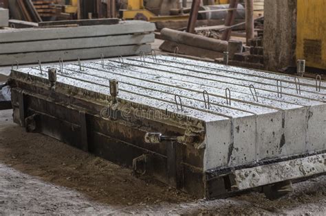 Stack of Precast Reinforced Concrete Slabs in a House-building Factory