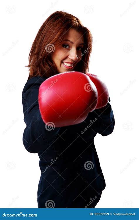 Smiling Businesswoman Wearing Boxing Gloves Punching Stock Image