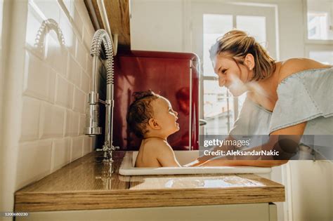 Baby Bath In A Kitchen Sink High Res Stock Photo Getty Images