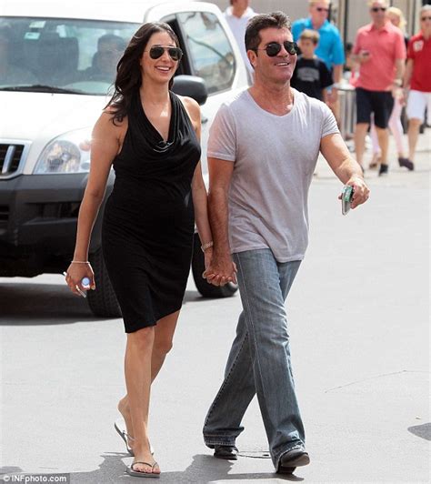 Simon Cowell Kisses Pregnant Lover Lauren Silverman As They Take Stroll