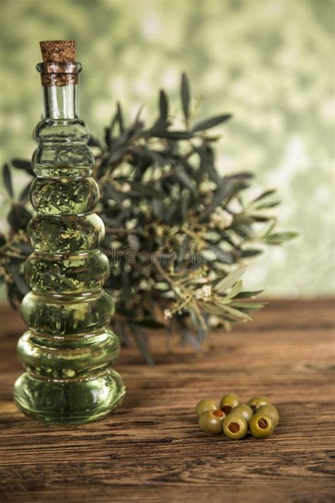 Olive Oil Olive Tree And Green Olives Bottles Of Olive Oil Stock