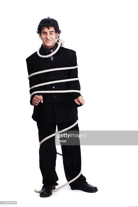 A Business Man Tied Up With A Rope High Res Stock Photo Getty Images