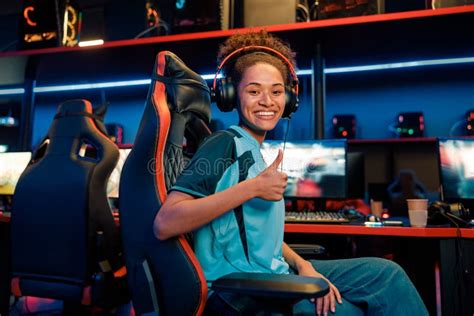 Female Gamer Succeed In Gaming Tournament In Computer Club Stock Image