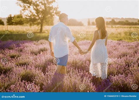 Couple In Lavender Field Romantic Time At Sunset Stock Photo Image Of