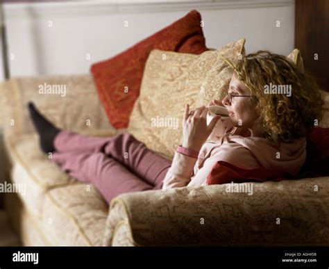 Young Woman Putting Her Feet Up Stock Photo Alamy