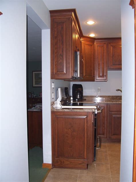 It's a bit easier to install cabinet filler strips in this situation. Cabinet Side Paneling Example - Darker Cherry Kitchen Cabinets | Cherry kitchen, Cherry cabinets ...