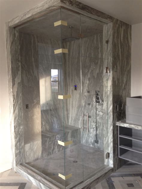 For a custom steam shower installation there are many individual pieces that you will need in order for your installation to function well. Large frameless glass steam shower enclosure. The glass is ...