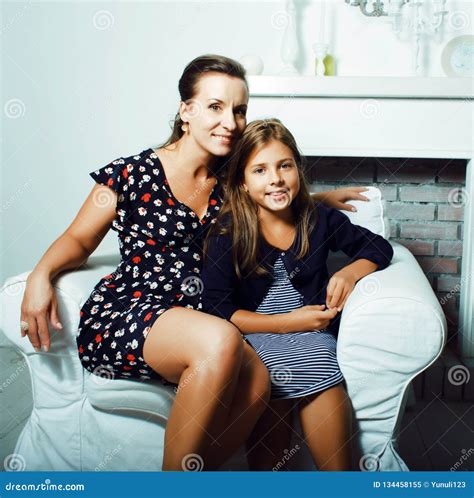 Portrait Of Smiling Young Mother And Daughter At Home Happy Fam Stock Image Image Of Playing