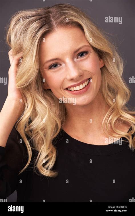Sweet And Beautiful Portrait Of A Beautiful Young Blonde Woman Smiling