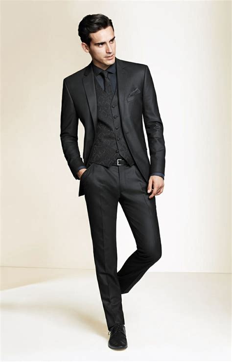 Bow ties and tuxedos look good in black and charcoal often. Men Suit Wear | Wedding suits men, Well dressed men, Suits