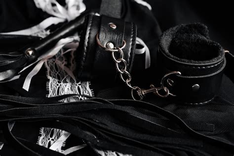 premium photo leather handcuffs and whip for bdsm sex