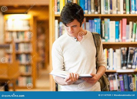 Serious Student Reading A Book Stock Image Image Of Holding Indoor