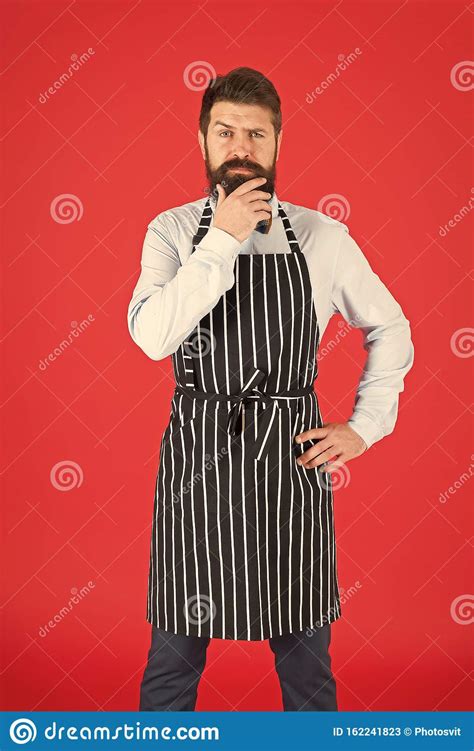 Thinking About New Recipe Elegant Waiter Man Or Bartender Bearded Man Wearing Bib Apron Stock
