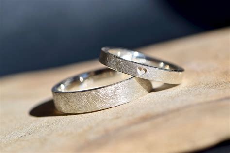 Simple Wedding Rings In White Gold With An Engraved Heart