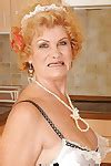 Lusty Granny In Maid Uniform And Stockings Stripping In The Kitchen At
