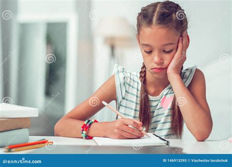 Close Up Portrait Of Bored Cute Afro American Girl Doing Writing