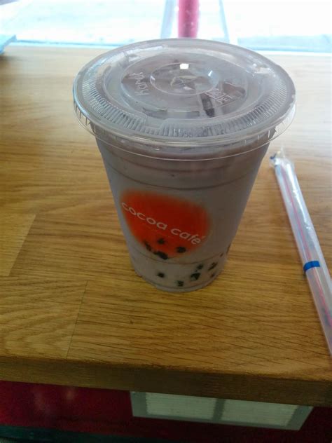 Bubble tea milk tea with tapioca balls. Taro Milk Tea from Cocoa Cafe | Julie's Dining Club