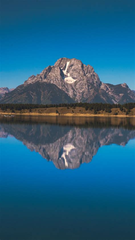 Download Wallpaper 1350x2400 Lake Mountains Shore Water Reflection