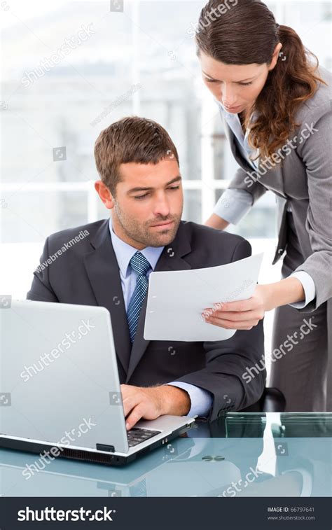 Two Business People Looking Paper While Stock Photo 66797641 Shutterstock