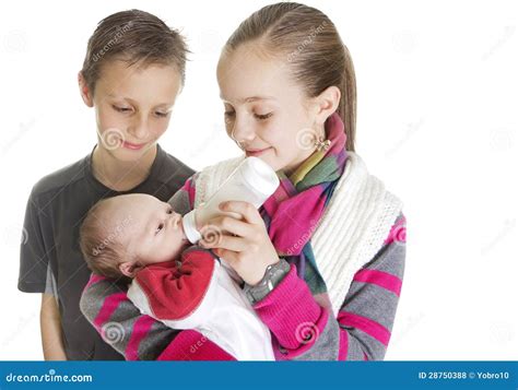 Siblings Caring For Their New Baby Brother Stock Photo Image Of