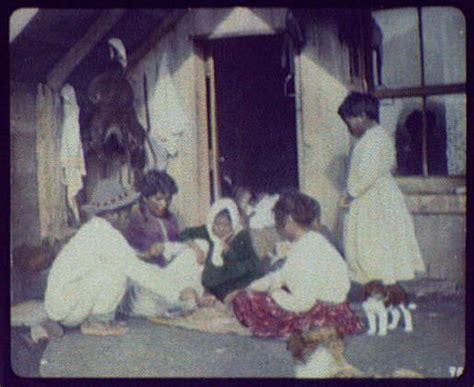 Filemaori Woman And Children Playing Cards On Doorstep Of Home
