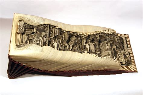 Artist Uses Surgical Tools To Carve Books Into Stunning Works Of Art