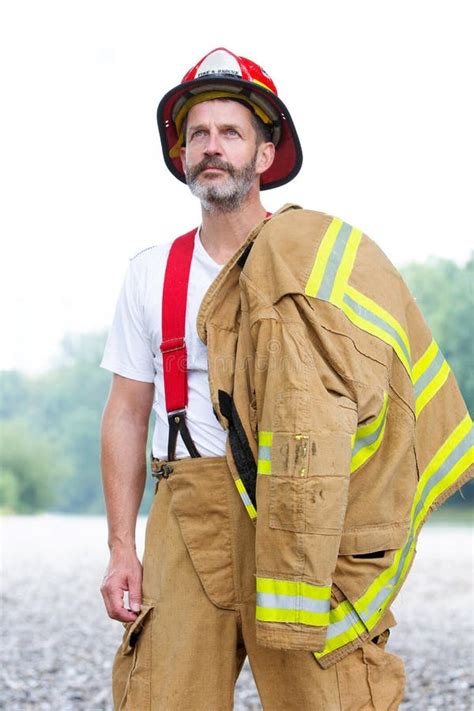 Handsome Fireman In Uniform Standing Outdoors Stock Photo Image Of