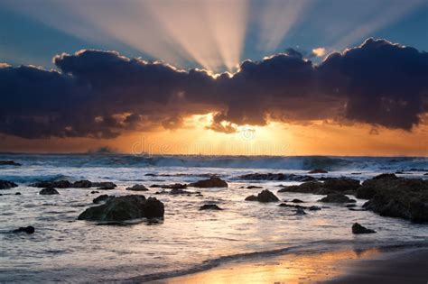 Sunrise Landscape Of Ocean With Waves Clouds And Rocks