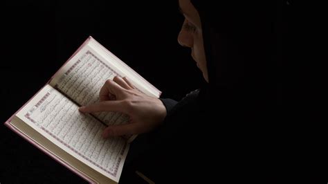A Muslim Woman In Hijab Holding Quran Reads Stock Footage Sbv 338351972