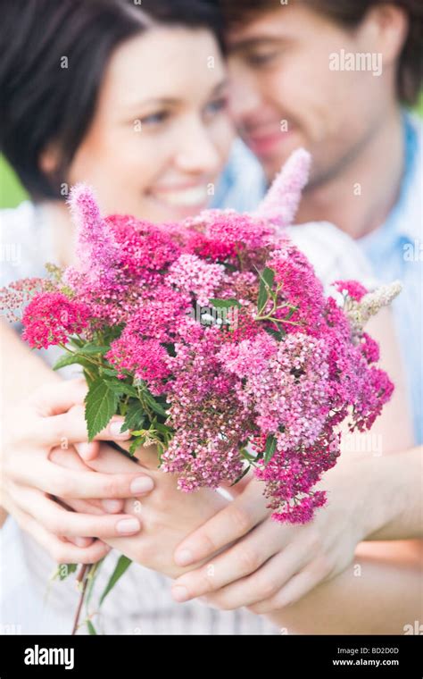 Loving Couple With Flowers Stock Photo Alamy