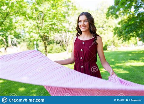 Happy Woman Spreading Picnic Blanket At Park Stock Image Image Of Summer Lovely 194937147