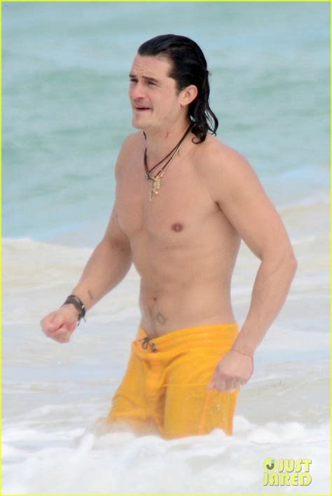 Orlando Bloom Shows Off His Soaking Wet Shirtless Body On The Beach