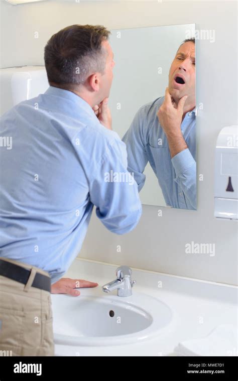 Man Looking In Mirror Stock Photo Alamy