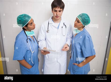 Doctor Talking To Two Nurses Stock Photo Alamy