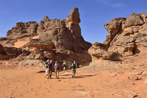 Algeria Sahara Tassili Najjer National Park Group Of People Hiking