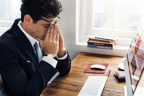 Business Man Frustrated Tired Office Desk Concept - Financial Advocates