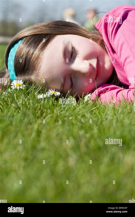 Detail Of A Girl Lying Down On Grass Stock Photo Alamy