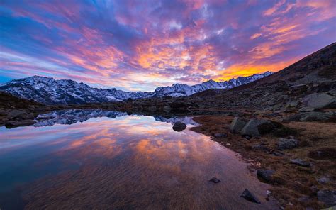 Alpine Lake In Italian Alps Colorful Sky Sunset Snow