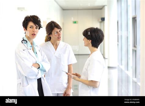 Doctors And Nurses Talking In Corridor Hospital Stock Photo Alamy