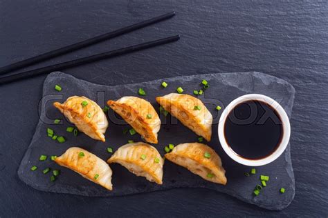 The fried dumpling series launched by weichuan usa is a delicious presentation by our exclusive r&d team. Traditional asian dumplings gyoza with ... | Stock image ...